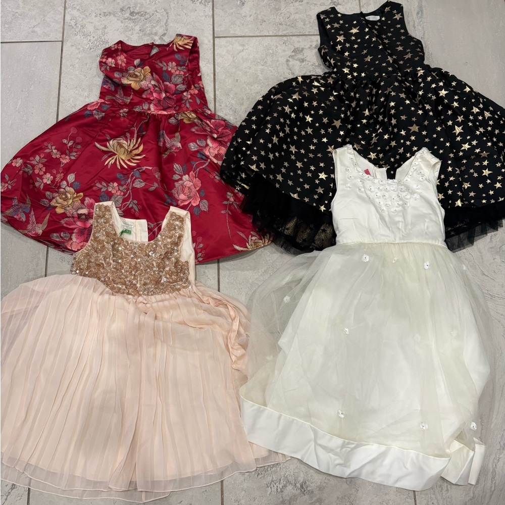 Lot of 4 used Floral and Star Patterned Dresses for $30 size 10/11 and 11/12